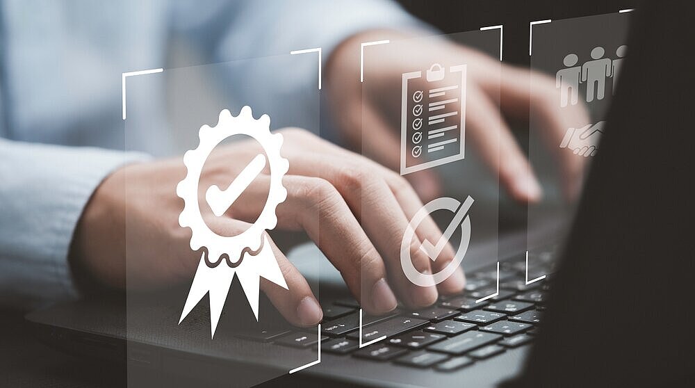 Businessman,Using,Laptop,Computer,With,Quality,Assurance,And,Document,Icon